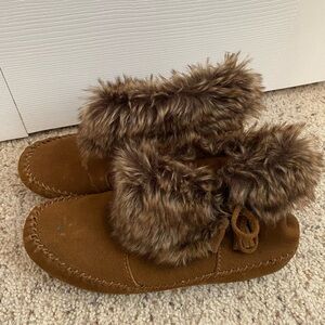 Brown fur lined Minnetonka moccasins
